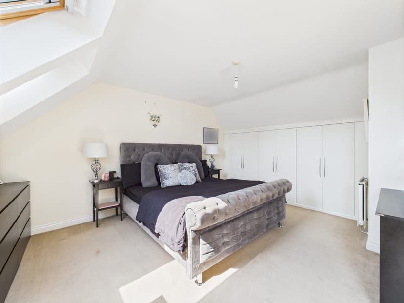 Plain bedroom before makeover with basic white walls and minimal decor